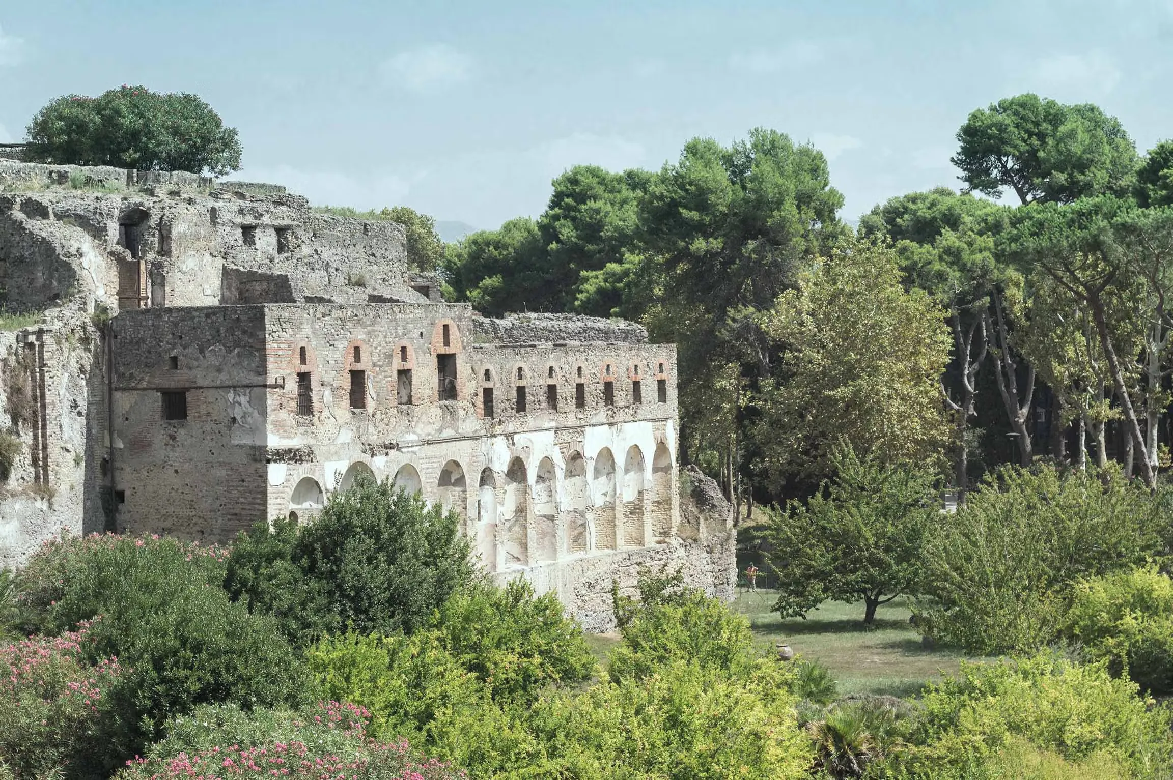 Panoramic view of Pompeii archaeological ruins with Mount Vesuvius in background